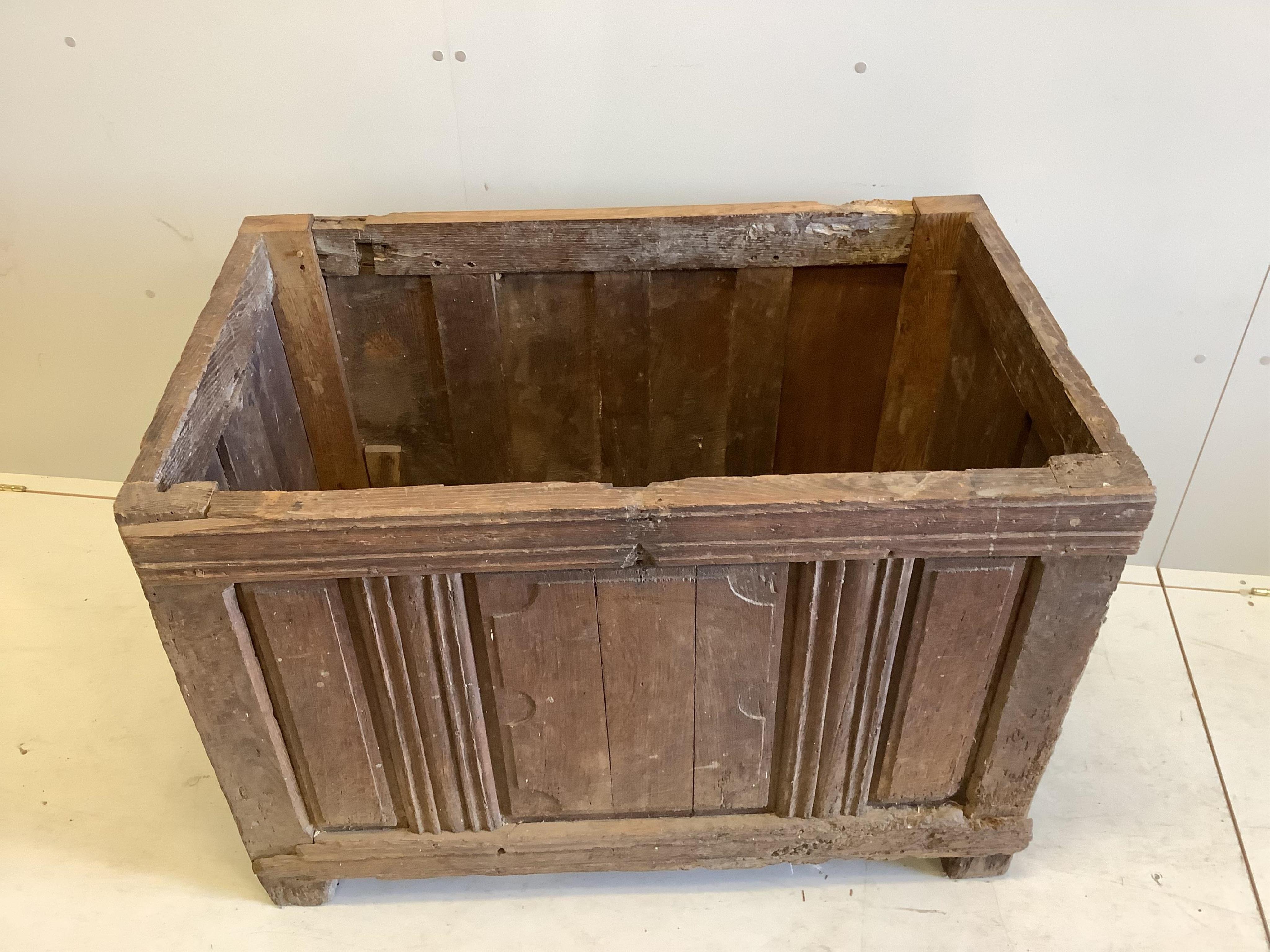 A 17th century style oak coffer (lid un-attached), width 111cm, depth 67cm, height 76cm